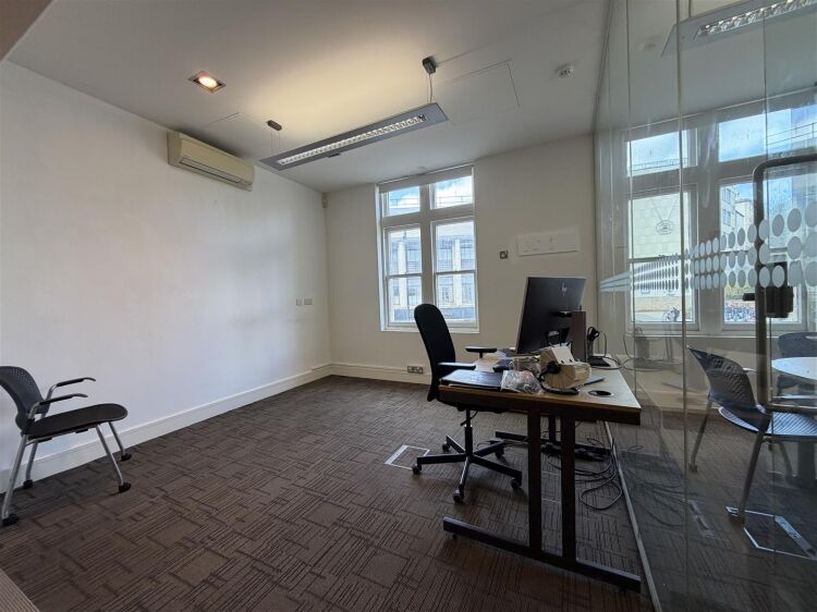 A well presented office suite extending to approximately 511 sq ft, thoughtfully arranged to provide a spacious open plan working area with the benefi Photo 5