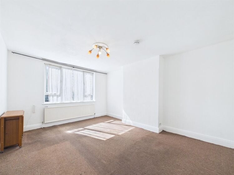 A large mixed-use investment property arranged as a ground floor shop (of approx. 740 ft²) with a large and self contained 2 bedroom flat above a Photo 5