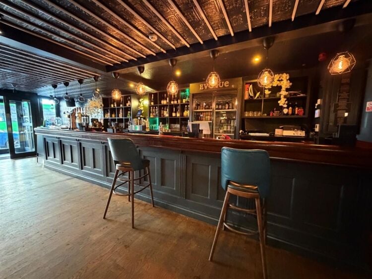 A fully fitted bar of approximately 1,035 ft² with additional basement stores and toilets, and an enclosed rear courtyard garden. the unit was pr Photo 5