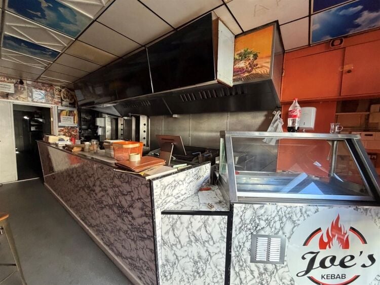 A mid terrace takeaway, of approximately 600 ft², with commercial extraction and additional first floor ancillary storage (of approx. 350 ft² Photo 5