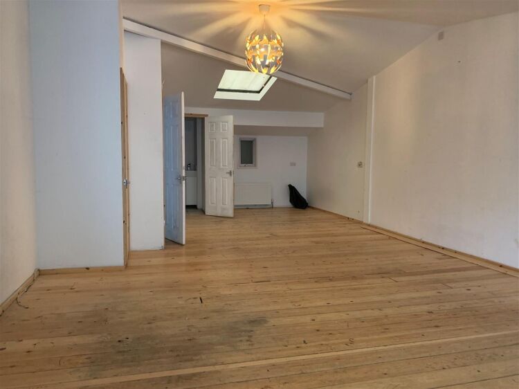 An end of terrace two storey workshop/office of approximately 1,014 ft² (94m²) with roller shutter access and off street parking to the fron Photo 6