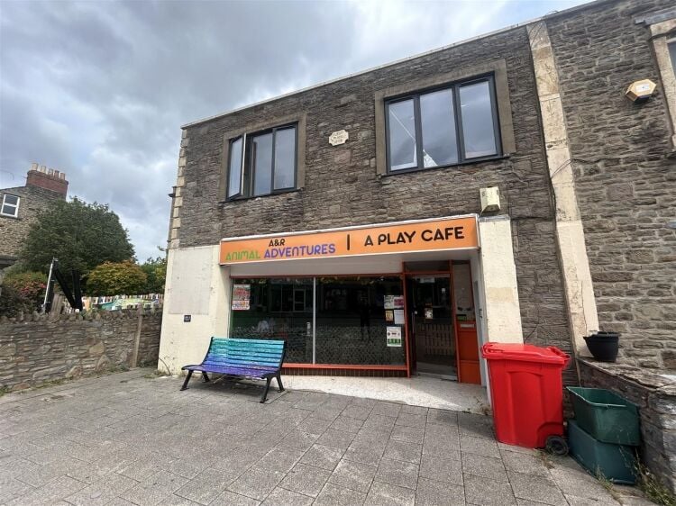 A ground floor retail unit of approximately 690 ft² arranged as an open plan shop area with rear storage, kitchenette and wc. Photo 6