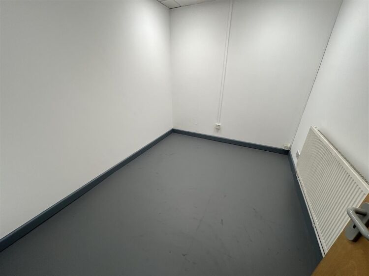 A ground floor office of approx 1,500 ft² with additional toilet facilities. the property benefits from allocated parking, security shutters, and Photo 6
