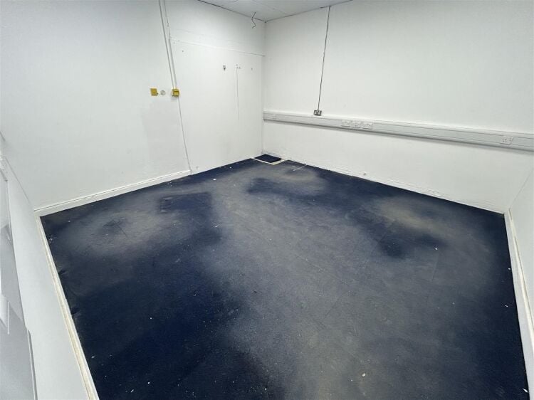Ground floor industrial unit/workshop of approximately 1,256 sq ft arranged as open plan workspace with adjoining storage and workshop space. the unit Photo 6