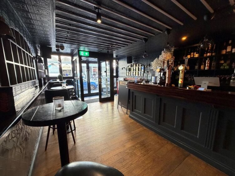 A fully fitted bar of approximately 1,035 ft² with additional basement stores and toilets, and an enclosed rear courtyard garden. the unit was pr Photo 6