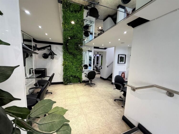 An extended two-storey retail premises located in the town centre, let to reflections hair salon at £32,000 per annum on a 10-year fully repairin Photo 6