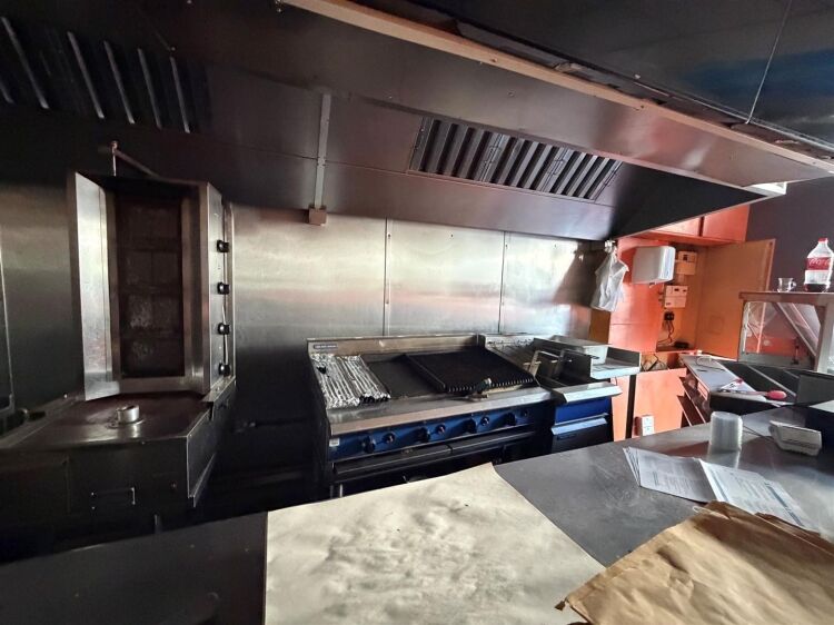 A mid terrace takeaway, of approximately 600 ft², with commercial extraction and additional first floor ancillary storage (of approx. 350 ft² Photo 6