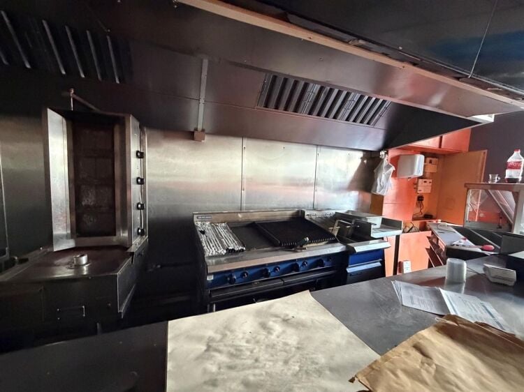 A mid terrace takeaway, of approximately 600 ft², with commercial extraction and additional first floor ancillary storage (of approx. 350 ft² Photo 6