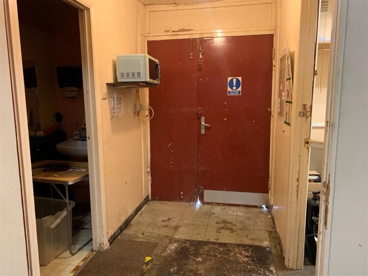 Terraced retail unit available in Bristol, featuring reception area, office, and rear toilet. Photo 7