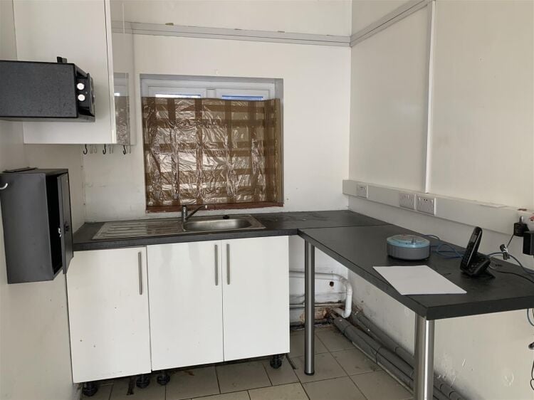 Ground floor retail unit of approximately 834 sq ft arranged as open plan retail area with rear kitchenette, and wc facilities. Photo 7