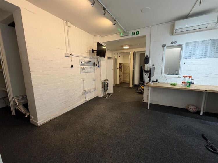 A well presented ground floor shop of approximately 500 ft² benefiting from a full width retail frontage and an internal security shutter. the un Photo 7