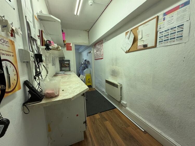 A ground floor retail unit extending to approximately 750 sq ft, most recently trading as a tanning salon. Photo 7