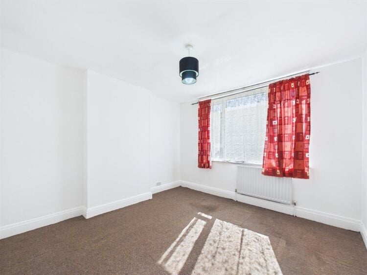 A large mixed-use investment property arranged as a ground floor shop (of approx. 740 ft²) with a large and self contained 2 bedroom flat above a Photo 7