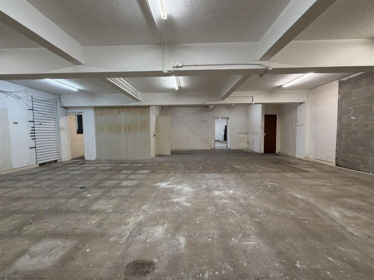 The property comprises a substantial retail unit extending to approximately 4,912 sq ft, arranged over ground and first floors. Photo 7