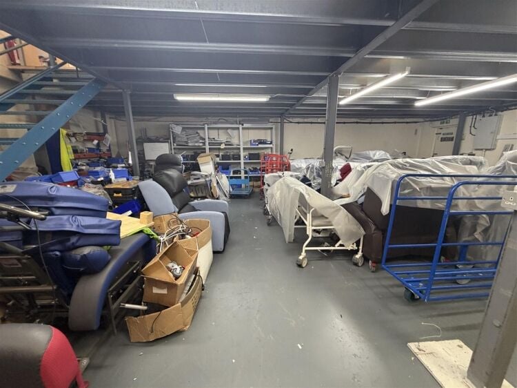 A modern unit of approximately 4,865 ft² arranged as a ground floor warehouse with roller shutter access, with additional first floor offices and Photo 7