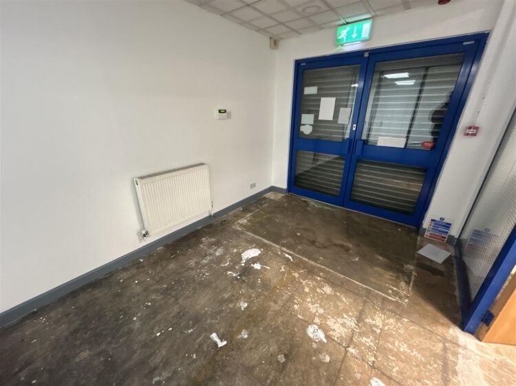 A ground floor office of approx 1,500 ft² with additional toilet facilities. the property benefits from allocated parking, security shutters, and Photo 8
