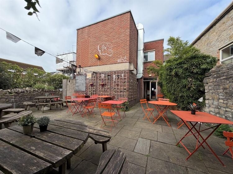 A fully fitted restaurant/bar extending to approximately 1,580 ft² benefiting from a fully equipped commercial kitchen, enclosed rear garden, and Photo 8