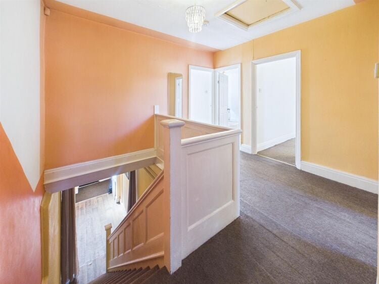 A large mixed-use investment property arranged as a ground floor shop (of approx. 740 ft²) with a large and self contained 2 bedroom flat above a Photo 8