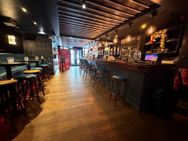 A fully fitted bar of approximately 1,035 ft² with additional basement stores and toilets, and an enclosed rear courtyard garden. the unit was pr Photo 8
