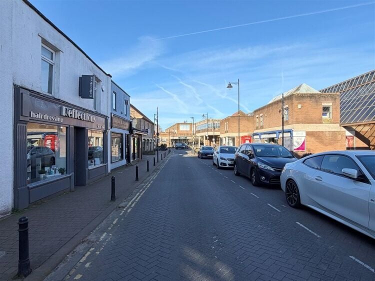 An extended two-storey retail premises located in the town centre, let to reflections hair salon at £32,000 per annum on a 10-year fully repairin Photo 8