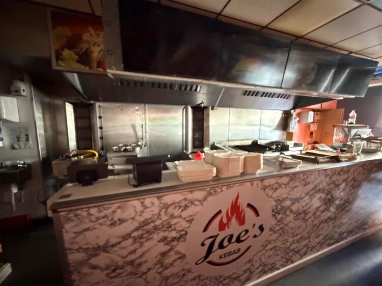 A mid terrace takeaway, of approximately 600 ft², with commercial extraction and additional first floor ancillary storage (of approx. 350 ft² Photo 8