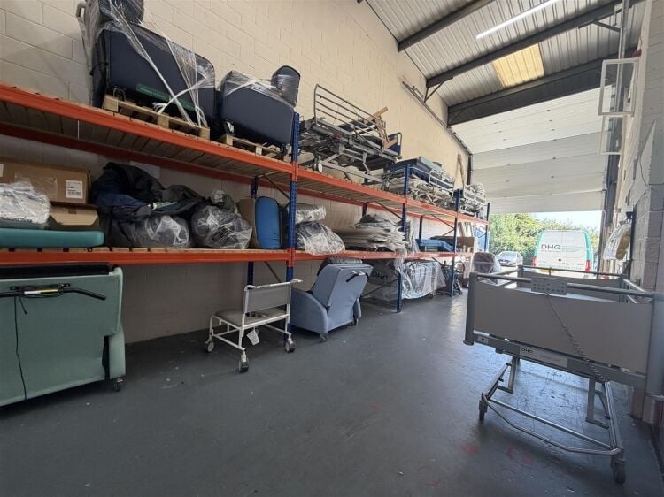 A modern unit of approximately 4,865 ft² arranged as a ground floor warehouse with roller shutter access, with additional first floor offices and Photo 8