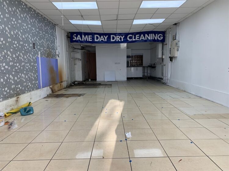 Ground floor retail unit of approximately 834 sq ft arranged as open plan retail area with rear kitchenette, and wc facilities. Photo 9