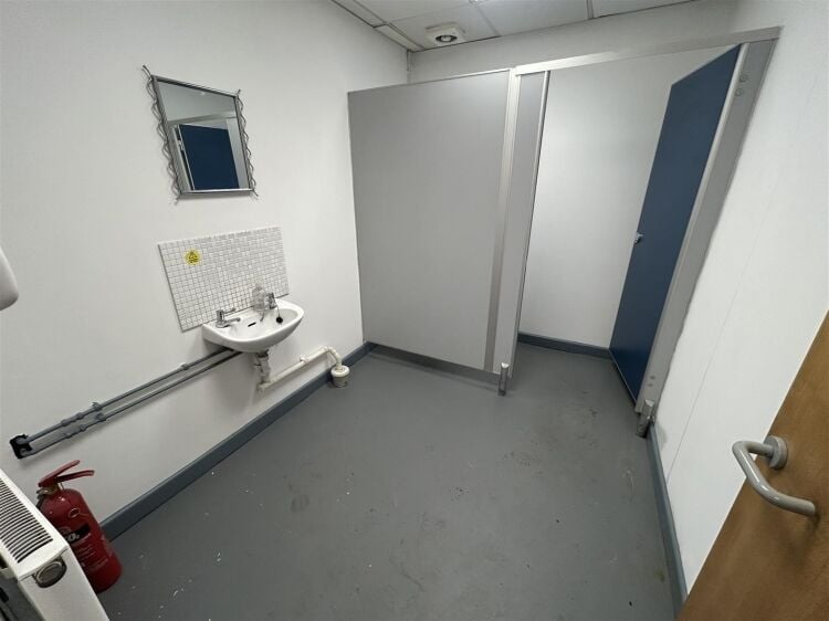A ground floor office of approx 1,500 ft² with additional toilet facilities. the property benefits from allocated parking, security shutters, and Photo 9
