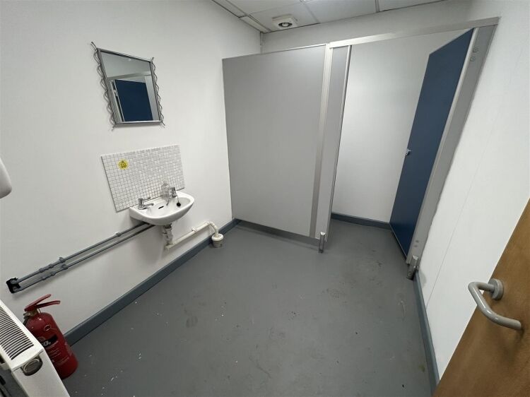 A ground floor office of approx 1,500 ft² with additional toilet facilities. the property benefits from allocated parking, security shutters, and Photo 9