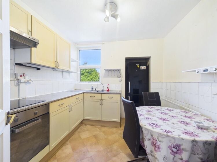 A large mixed-use investment property arranged as a ground floor shop (of approx. 740 ft²) with a large and self contained 2 bedroom flat above a Photo 9