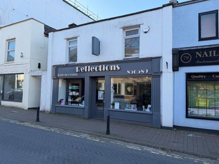 An extended two-storey retail premises located in the town centre, let to reflections hair salon at £32,000 per annum on a 10-year fully repairin Photo 9