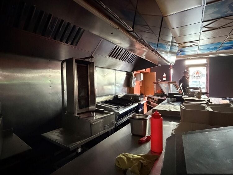 A mid terrace takeaway, of approximately 600 ft², with commercial extraction and additional first floor ancillary storage (of approx. 350 ft² Photo 9
