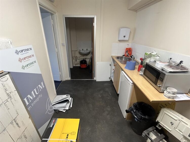 A modern industrial unit of approx 2,994 ft². the ground floor is arranged as a unit with roller shutter access with reception/office, kitchen a Photo 9