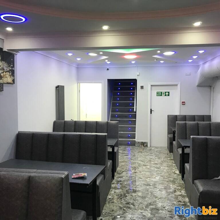 Busy Indian Kebab curry takeaway with seating Photo 2