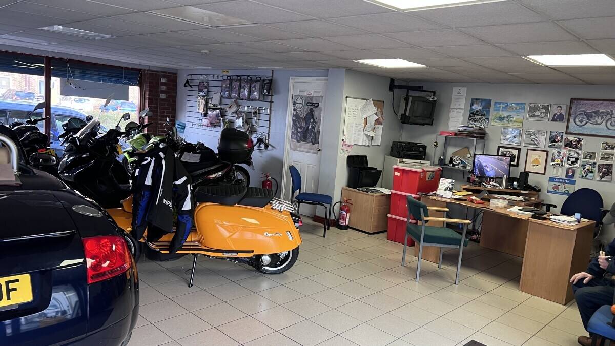 Established Car sales and repair dealership with flats.With planning permission to build on Photo 10
