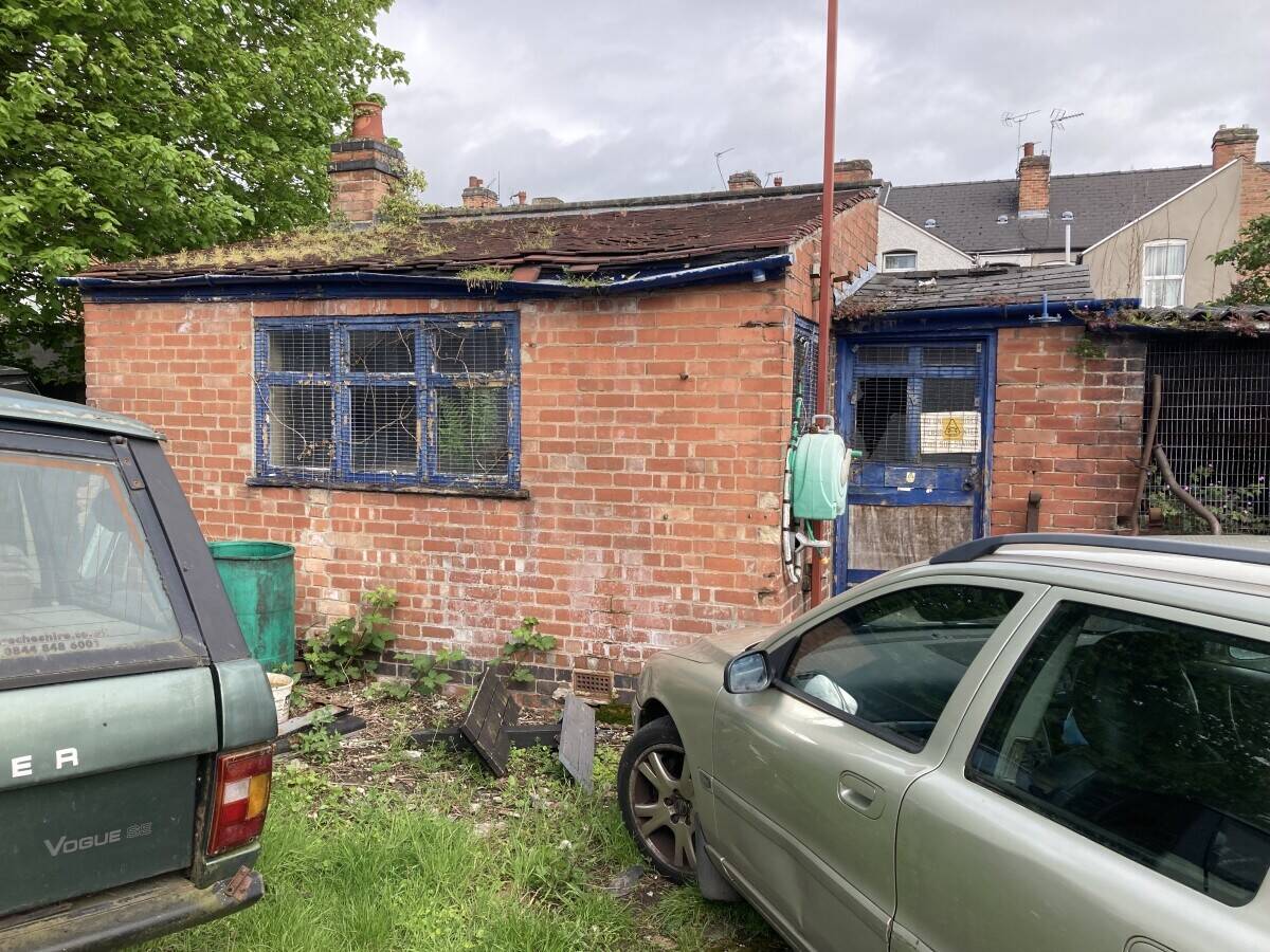 Freehold large garage and yard. Garage will take up to 5 cars and work on them. Parking for 12 cars.