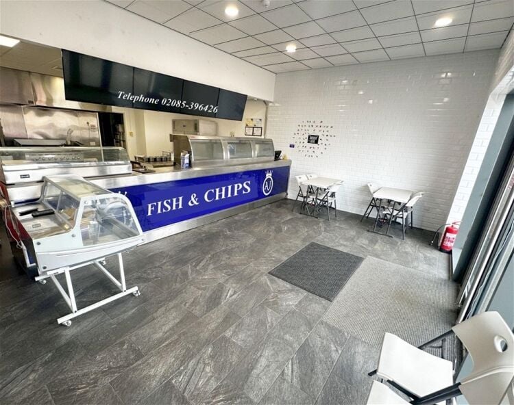 Modern fish & chip takeaway, end-of-parade Upton