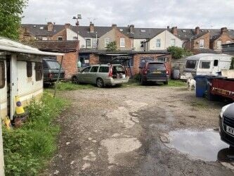 Freehold large garage and yard. Garage will take up to 5 cars and work on them. Parking for 12 cars.