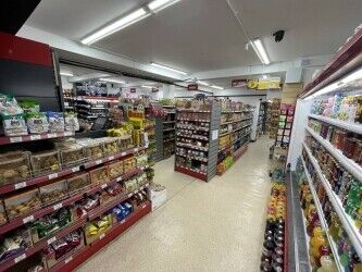 Off license, international foods, halal butchers. Photo 1