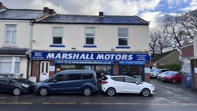 Established Car sales and repair dealership with flats.With planning permission to build on