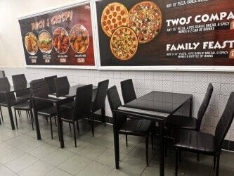 Very busy Pizza and chicken shop on High street with living accom.