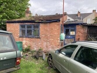 Freehold large garage and yard. Garage will take up to 5 cars and work on them. Parking for 12 cars.