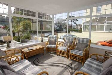 Profitable 15-Bedroom En-Suite Hotel Near Beach & Town Centre Profitable 15-Bedroom En-Suite Hotel Near Beach & Town Centre
