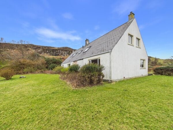 Island retreat with superb harbour views and potential