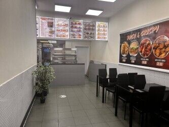 Very busy Pizza and chicken shop on High street with living accom.