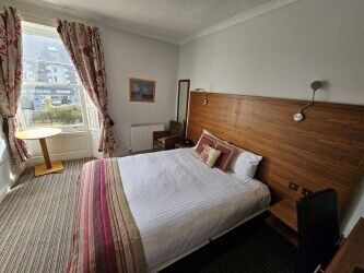 The County Hotel occupies a prominent location on the High Street of the historical town of Selkirk. Photo 3
