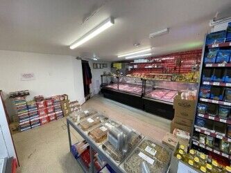 Off license, international foods, halal butchers. Photo 3