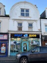 Well established laundrette business with two self-contained flats