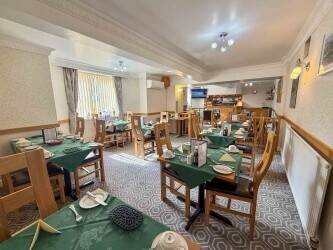 Profitable 15-Bedroom En-Suite Hotel Near Beach & Town Centre Profitable 15-Bedroom En-Suite Hotel Near Beach & Town Centre