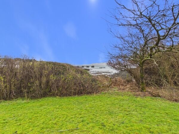 Island retreat with superb harbour views and potential